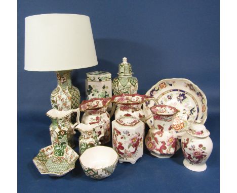 A collection of Masons Ironstone Applique pattern wares comprising a lamp base, a vase and cover of octagonal form, two gradu