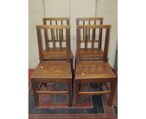 A set of four Georgian country made dining chairs with reeded stick backs over solid seats and square cut and moulded support