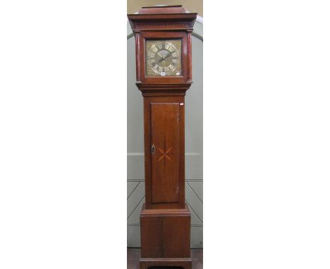 An 18th century oak longcase clock, the full length door with starburst detail, the hood with fruit wood column supports encl