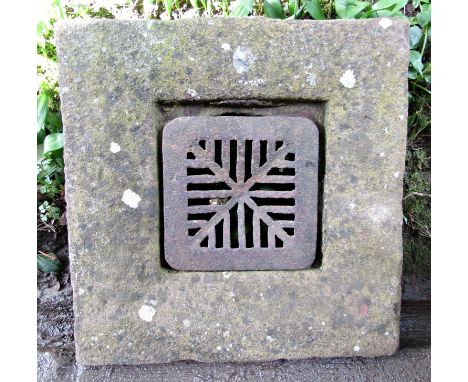 A weathered natural stone trough of square form with drainage hole, 46 cm square x 26 cm high, together with a further natura