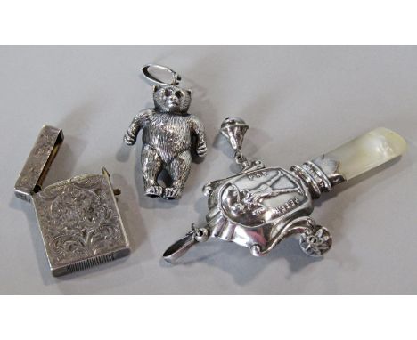 A small child's silver rattle in the form of a teddy bear, further silver plated example with mother of pearl Peter Pan teeth