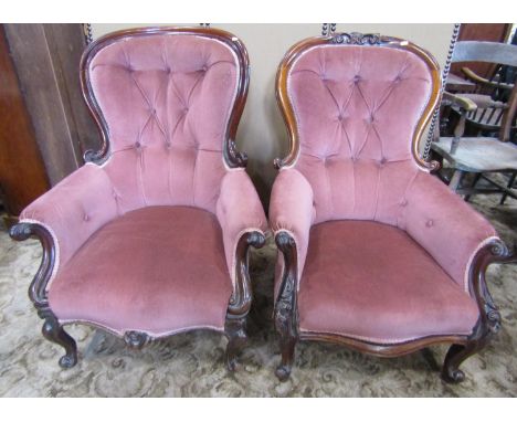 Two similar Victorian mahogany spoon back drawing room chairs with upholstered seats and button back within shaped carved and