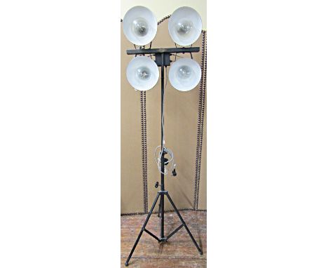 A retro studio lantern on telescopic frame supporting four adjustable lights, traditional green enamelled lampshades - The No