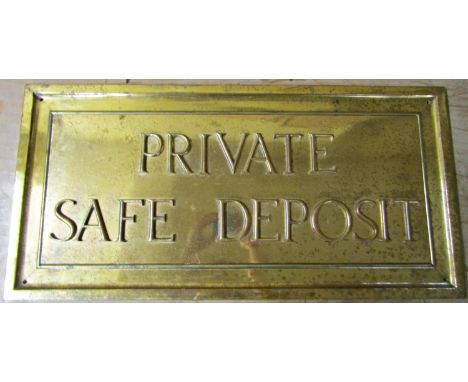 A heavy bronze panel - private safe deposit set within moulded bronze frame, 32 cm x 66 cm 
