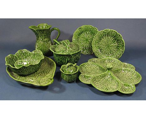 A collection of Portuguese leaf moulded wares comprising a sectional serving dish, a tureen and cover and ladle, a leaf shape
