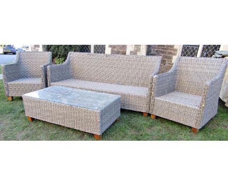 A faux wicker effect four piece garden/conservatory suite comprising sofa, pair of chairs and rectangular low table 