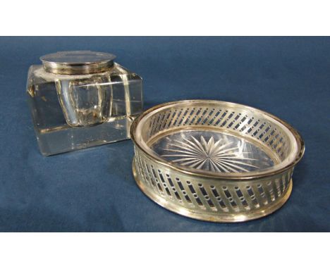 An early 20th century cut glass ink well with a silver cap, London 1915, maker John Collard Vickery, together with a silver a