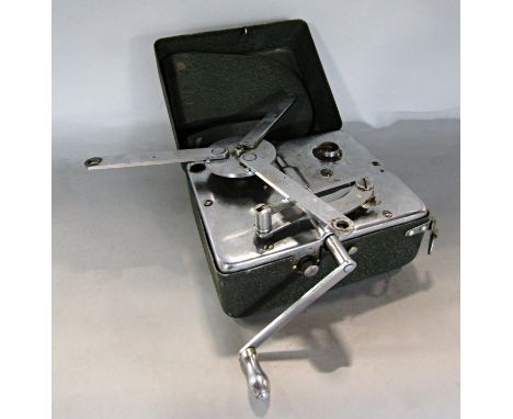 A Vintage Mikky portable record player contained within a green tin box, in working order but stylus missing.14.5cm x 12cm cl