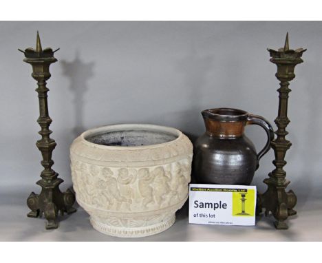 A collection of earthen ware, pitcher, jugs, flagons, a jardinière with cherub decoration, and a pair of bronze altar style c