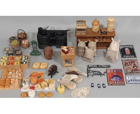 A collection of dolls house grocery shop fittings and produce, including counter, butchers table, bakery, cheese, fruit, vege