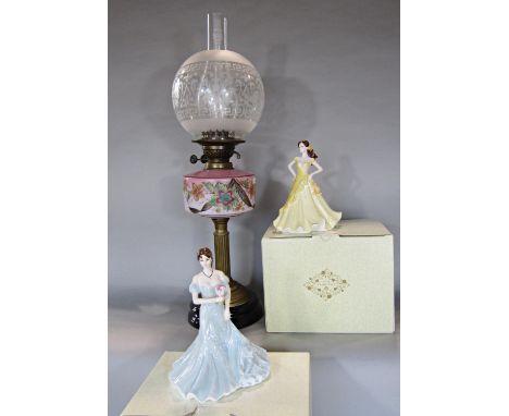 A Chris Lucas Atlas oil lamp with a floral pink font and etched glass shade on a reeded brass column 64cm high, and two Coalp