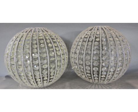 A pair of spherical beaded 'glass' light shades. 36cm diam.