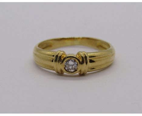 Yellow metal diamond solitaire ring, size K, 2.2g 