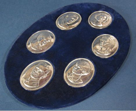 An oval blue velvet lined stand with six silver medallions of the Royal Family, celebrating the Silver Jubilee of 1977, 8.5oz