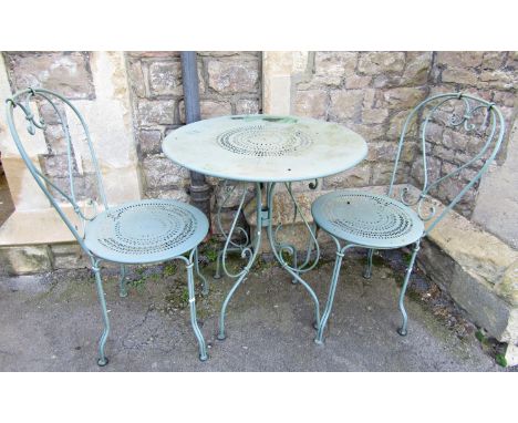 A light green painted steel three piece garden terrace set comprising circular top table and a pair of matching chairs with s