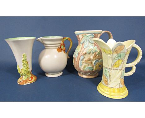 A Newport Pottery Clarice Cliff jug with relief moulded floral detail to the handle and moulded numbers to base 895, 23cm tal