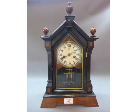 A mahogany and ebonised mantle clock