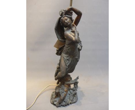 A 19th Century spelter table lamp in the form of a maiden.