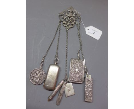 A silver chatelaine, with various silver pocket tools to include a sovereign case, folding ivory handled scissors in case, no