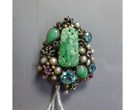 A vintage white metal brooch inset with central jade plaque having aquamarine rose quartz and seed pearl decoration. 