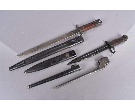 An Indian SMLE bayonet and scabbard, dated 44, together with a No.5 Jungle carbine and scabbard, and a No.4 MkII spike bayone