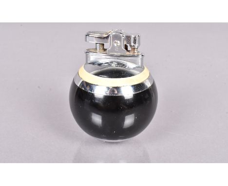 A Ronson Rondelight Ball table lighter, in black and cream lacquered finish, circa 1950s, unused, good condition 