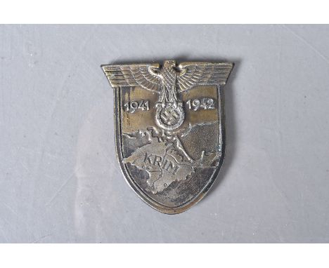 A WWII German Army/ Waffen-SS Krim Campaign shield, with dates 1941 and 1942 to the from, to the reverse, four blades, approx