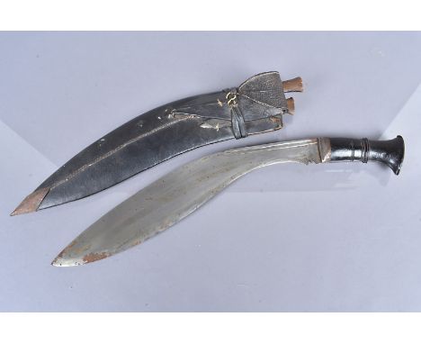 A Middle Eastern Kukri, with wooden handle, 40cm long blade, complete with leather scabbard and two skinning knives  