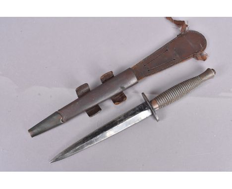 A Fairbairn Sykes third pattern fighting dagger, marked with a broad arrow and 'V' to guard, with number 1 to pommel, complet
