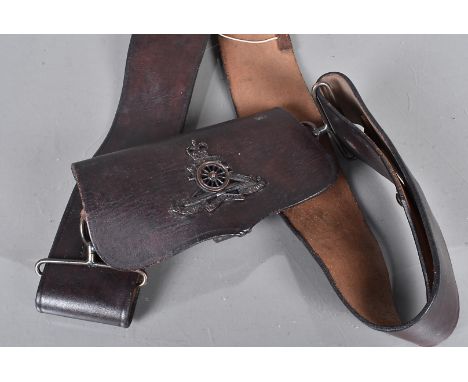 A 20th Century Royal Artillery Ammunition pouch and belt, the brown leather pouch with applied Royal Artillery badge, the bel