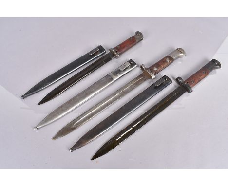 Three Czech VZ24 bayonets and scabbard, one a possible re-work, two with serial numbers to the pommels, all complete with ste