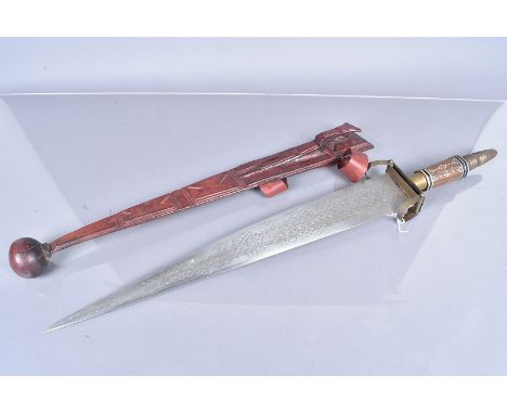 An African broadsword, with triangular 62cm long blade, with engraved design, with wooden inlaid handle, and brass pommel, co