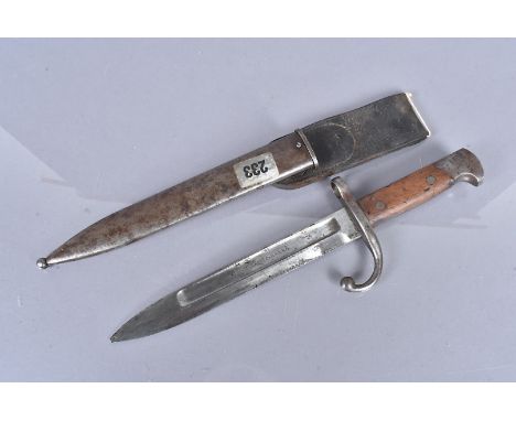 A Remington Arms Co bayonet and scabbard, maker's marked to the blade, complete with steel scabbard and leather frog, tip bro