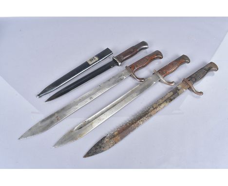 A German 98/05 Sawback bayonet, together with two German Butcher bayonets, a low ear by A-G, and a high ear by Simpson &amp; 
