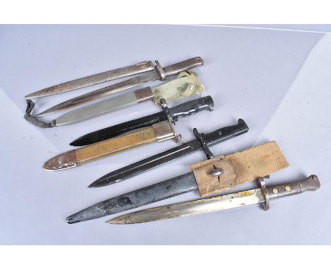 A group of world bayonets, comprising a British Pattern 1888 by Wilkinson, with frog, a Spanish Denix bayonet, looks to be a 