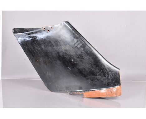 A wind tunnel test rudder for the B.A.E 146 Jet Engine (1984), in black, collected from the Wind Tunnel Test Facility in Wood