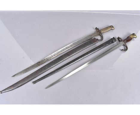 Two French bayonets, including a Gras, dated 1877, complete with scabbard, different serial numbers, and a Chassepot with sca