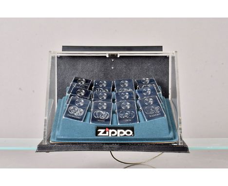 European Currency, a twelve Zippo lighter set, each stamed design to a polished chrome body, showing the currency of differen