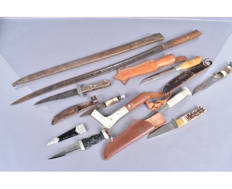 An assortment of knives, to include a Skean-dhu by Nowell &amp; Sons Ltd, AF, hunting knives, a J Marttiini knife, a converte