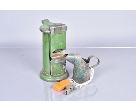 A Vintage Waterlow &amp; Sons ticket punch machine, in green, with maker's label to the top, together with vintage oil can, A