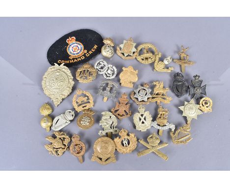 A group of British cap badges, including 1st Argyll Highland Rifle Volunteers, Inniskilling, Queen Mary's Auxiliary Army Corp
