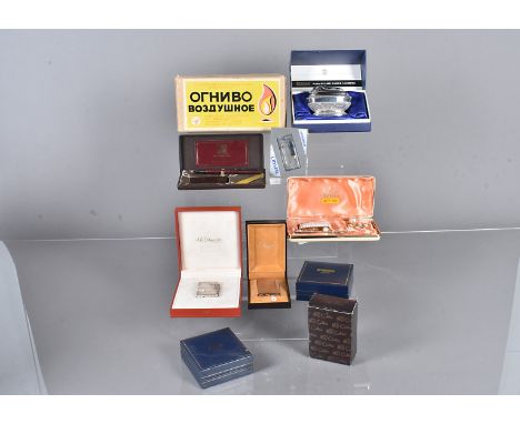 Two boxed Dupont lighters in original retailer's boxes, together with a collection of twelve other lighters in boxes and a Ro