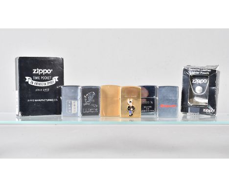 An assortment of various Zippo Lighters,  to include brushed brass, solid brass, Snap-on, Luck, and more, plus a Leather Ligh