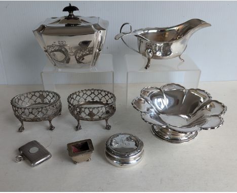 A pair of George III silver oval salts with pierced bodies on claw and ball feet, one with clear glass liner, 5 x 8 cm, hallm