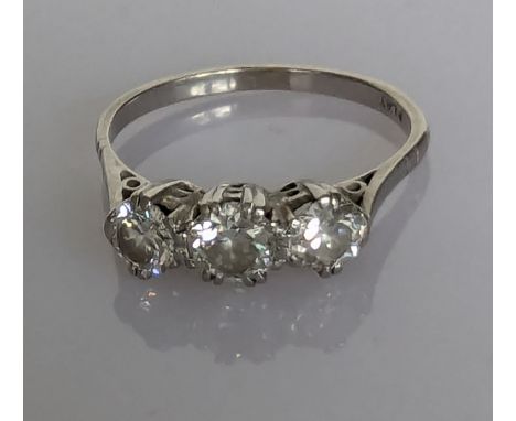 An Art Deco three-stone diamond ring on a platinum setting, each round-cut diamond approximately 0.25 carats, colour H, clari