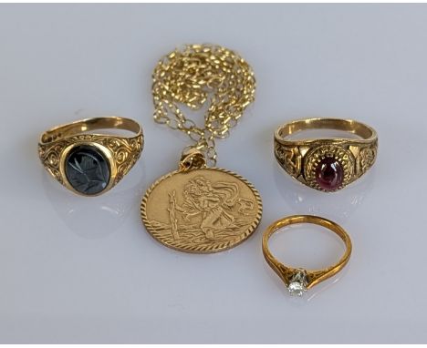 A 9ct yellow gold St. Christopher's pendant with thin belcher chain; two gold signet rings with carved decoration, all hallma