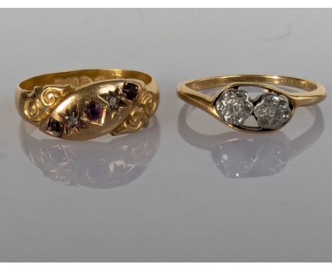 A George V diamond and ruby gold ring with carved decoration and a crossover diamond flower ring in an illusion setting, both