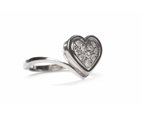 DIAMOND DRESS RINGthe heart shaped bezel with grain set diamonds, in eighteen carat white gold, size L-M