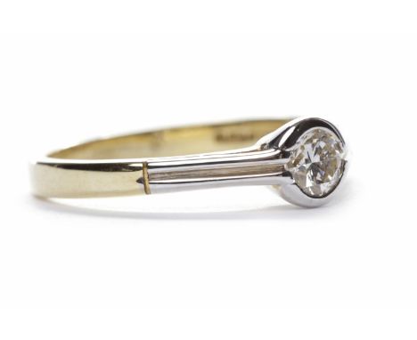 DIAMOND SOLITAIRE RINGthe round brilliant cut diamond of approximately 0.22 carats, in eighteen carat white and yellow gold, 