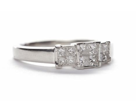 DIAMOND CLUSTER RINGwith princess cut diamonds totalling approximately 0.50 carats in stepped setting, in platinum, size M-N
